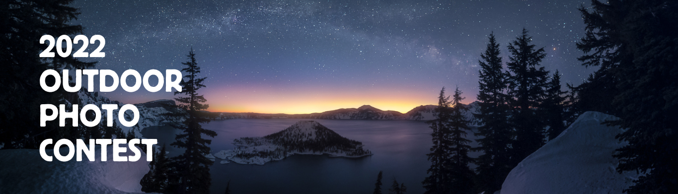 A snow scene from Crater Lake at sunset with Wizard island prominent in the center of the image - 2022 Outdoor Photo Contest