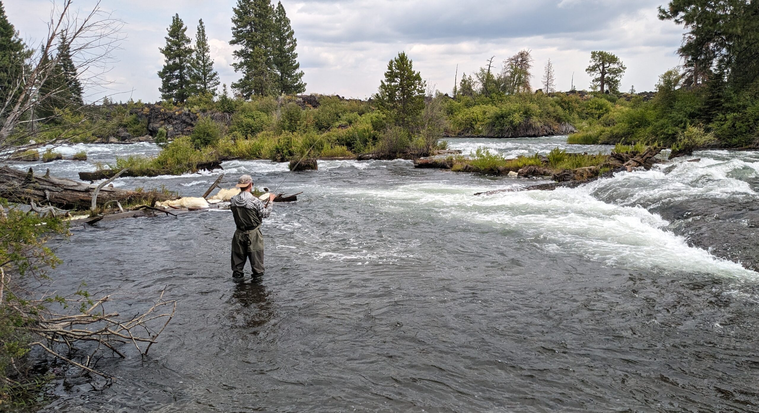 Man fishing on the Deschutes River in Oregon by Nick Gober