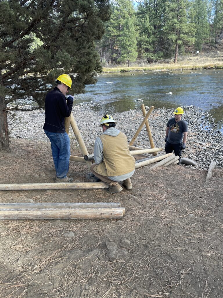 Volunteers put together a fence to protect a riparian area along the Deschutes River.